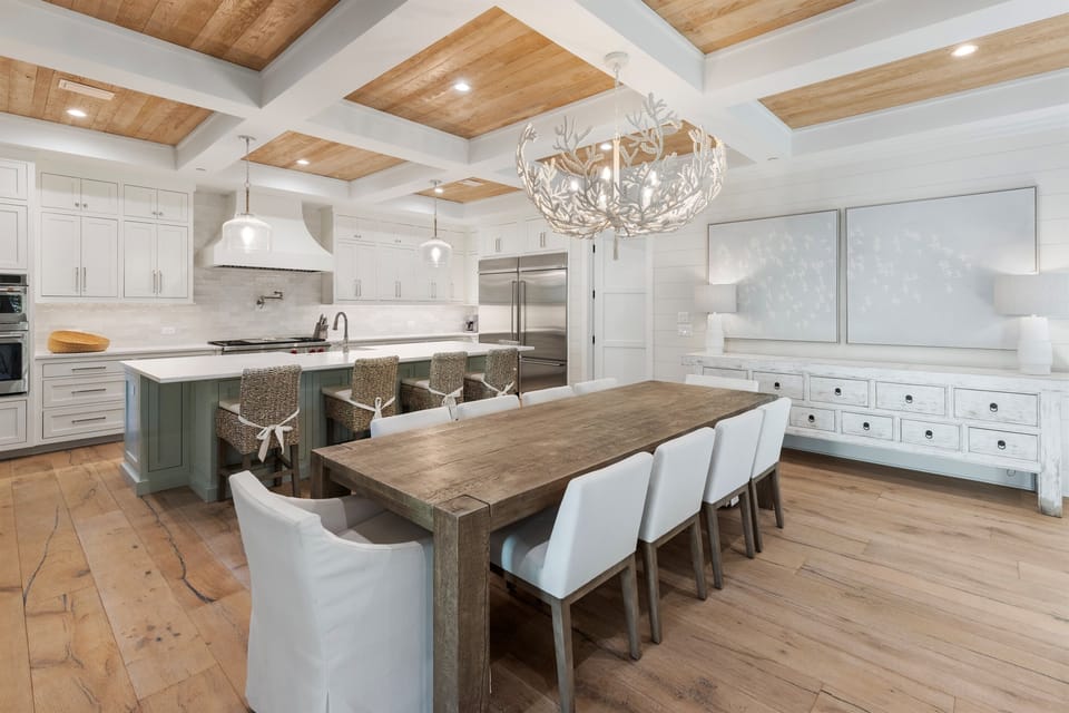 Cook memorable meals in your gourmet kitchen featuring wood beam ceilings, elegant fixtures, and spacious dining perfect for gathering.