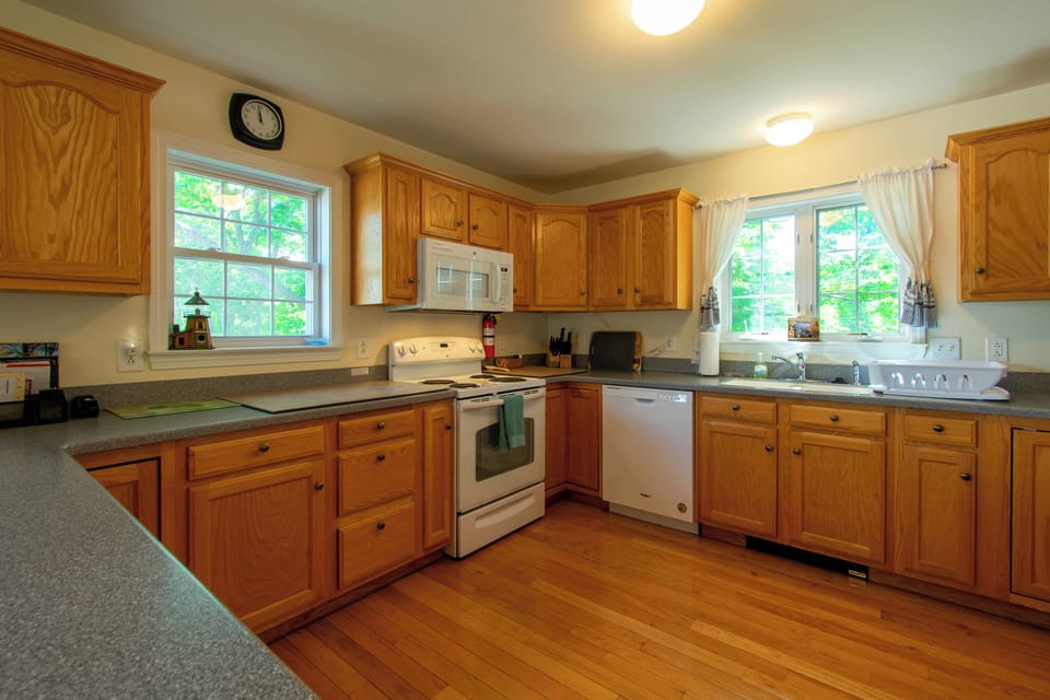 Kitchen has microwave, dishwasher, fully equipped.
