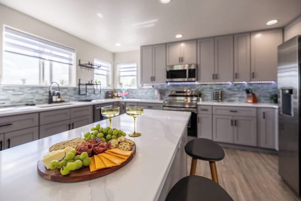 Charcuterie on deck, glasses poured, and plenty of space to spread out. This kitchen is ready for your crew.