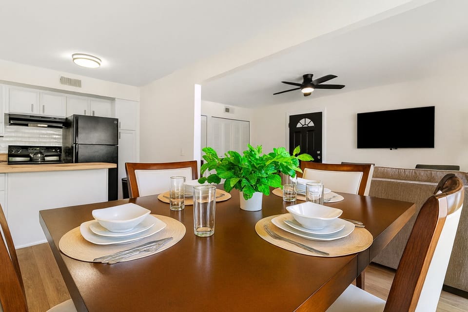 Chic dining area with seating for four, perfect for shared meals or work sessions.