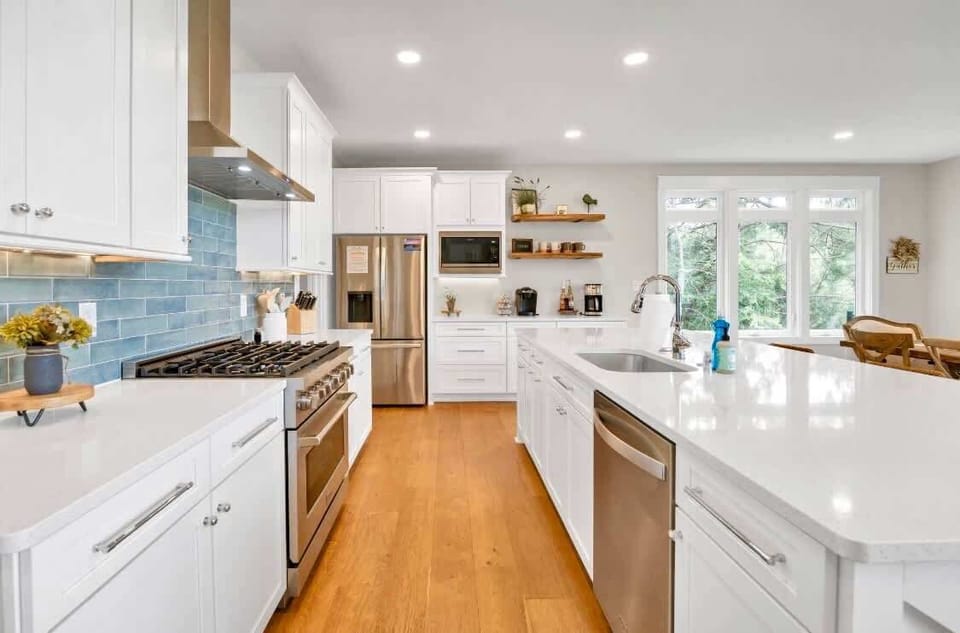 Guests will love to gather in this gourmet kitchen, stocked with high-end cookware and every essential you could need. Don't miss the impressive walk-in pantry! With breathtaking lake views and a spacious island  this kitchen is a chefs dream!