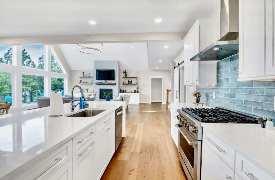 Kitchen -Welcome to our modern gourmet kitchen, featuring a high-end gas range, quartz countertops, a stunning 10-foot island, and all the amenities needed to create memorable meals &  moments together. Check out all the details in the following pics