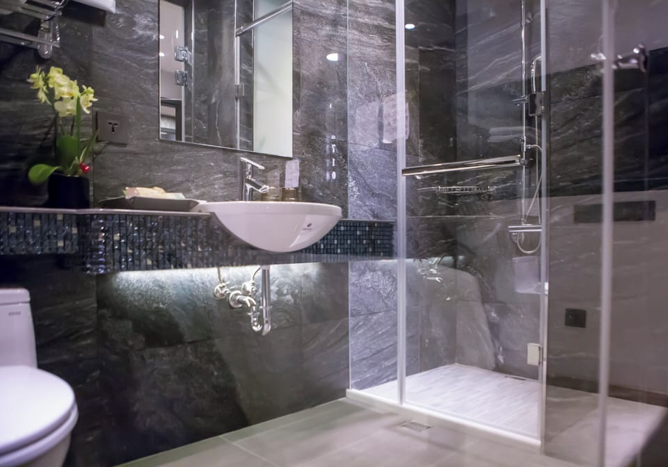 Separate tub and shower, free toiletries, hair dryer, slippers