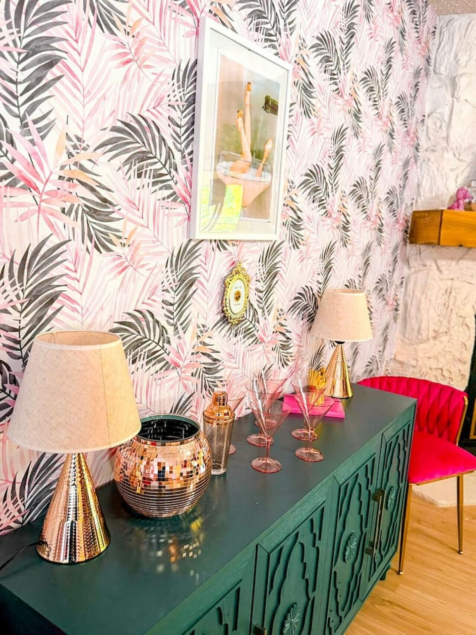 Chic tropical-inspired living space with vibrant pink accents, stylish bar setup, and modern statement décor perfect for Instagram-worthy moments.