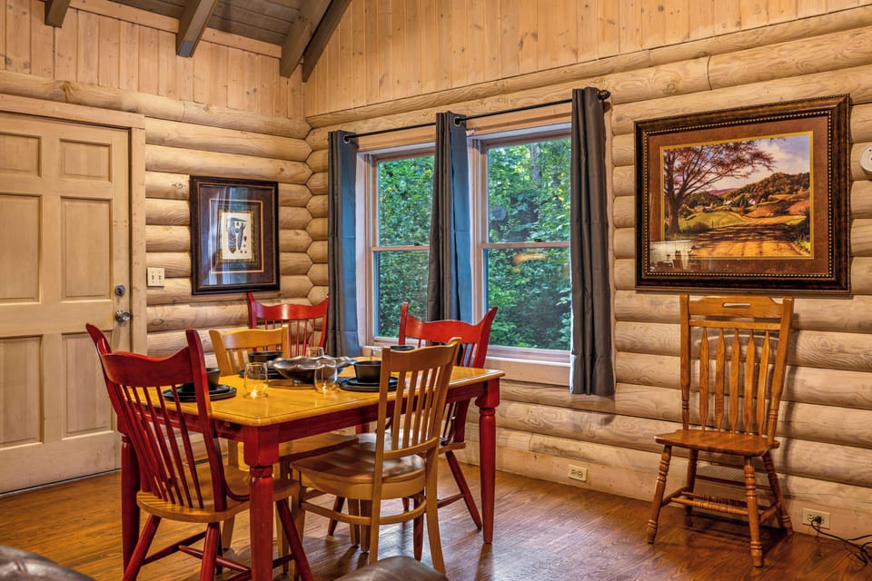 Your dining area, surrounded by log cabin charm and nature.