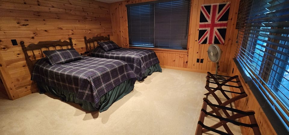 Rustic bedroom with two twin beds.