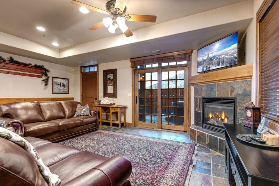 Settle in by the fireplace after a day outdoors in this warm, inviting space. PPS-1416