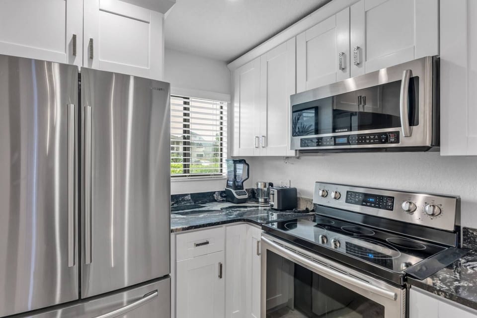 Kitchen is fully equipped with stainless appliances - refrigerator, range, microwave, dishwasher!