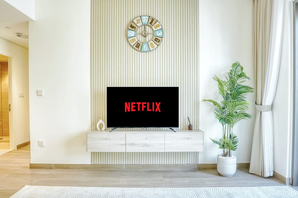 Premium Apartment, Balcony, City View | Living room | 55-inch Smart TV with digital channels