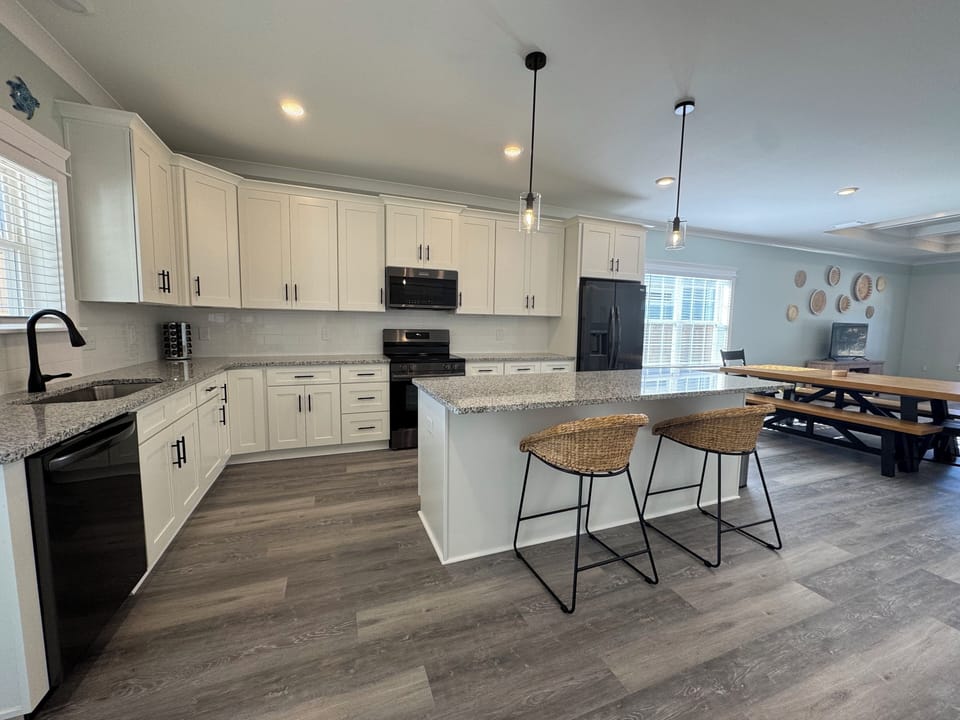 Full kitchen with stainless steel appliances, granite, baking and cook ware.