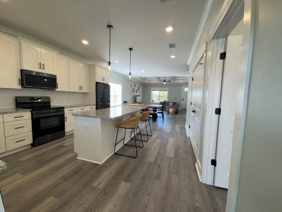 Full kitchen with stainless steel appliances, granite, baking and cook ware.