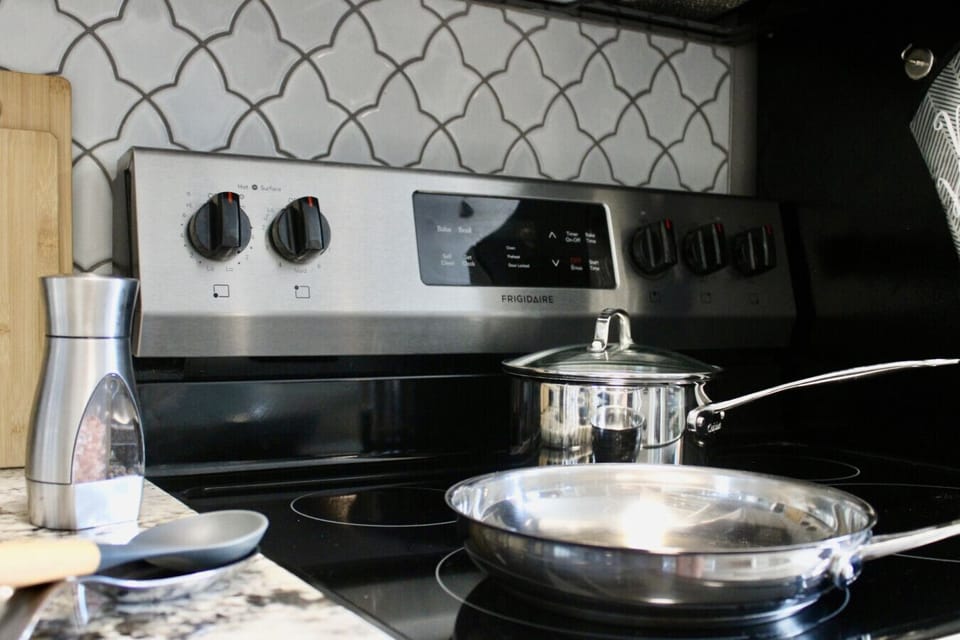 Sleek appliances await your culinary adventures in our stylish, well-equipped kitchen