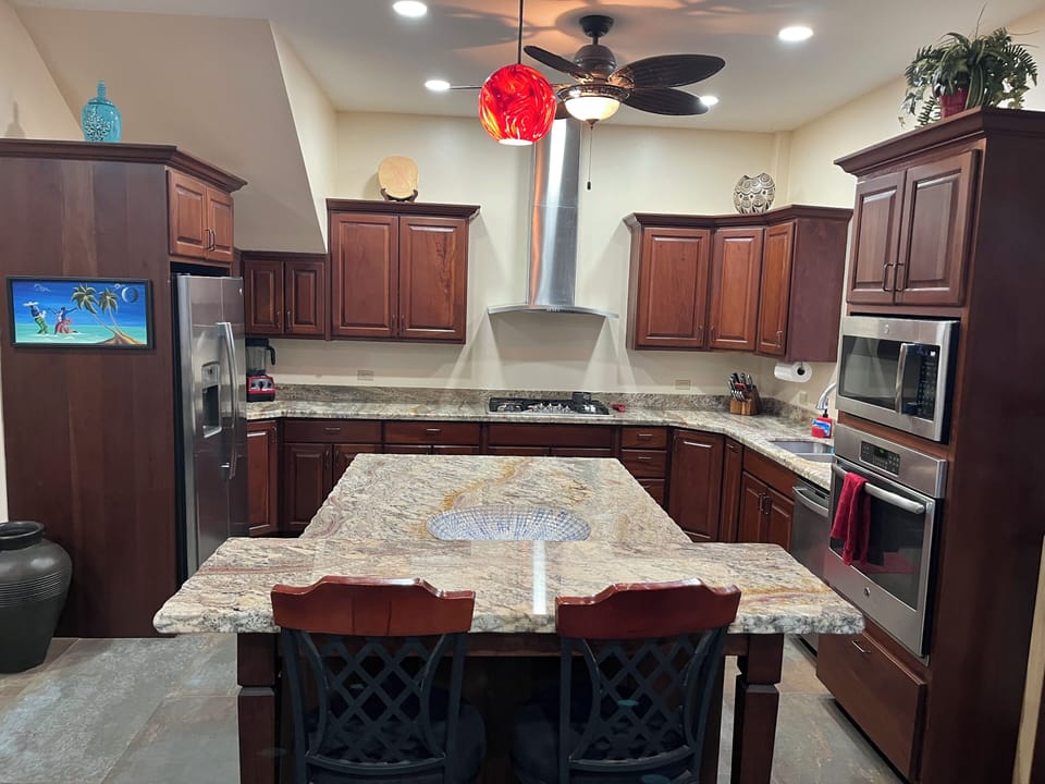 Fully equipped kitchen with gas range and upgraded appliances.