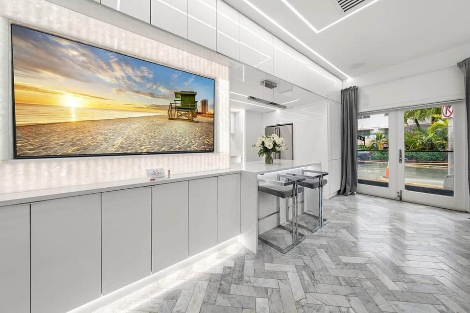 1st FLOOR: LIVING ROOM / PARTY LOUNGE features translucent stone with backlighting that surrounds our large smart TV where you can karaoke, watch a game, or Netflix and chill. 