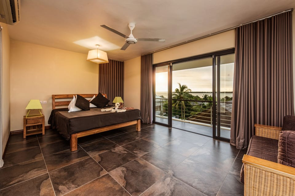 6.Deluxe Ocean & Island,Pool Front View | Minibar, in-room safe, desk, blackout drapes
