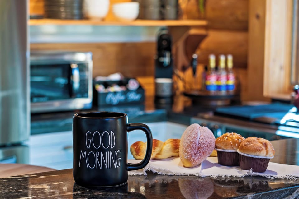 Start your day with fresh pastries and coffee in a cozy cabin kitchen