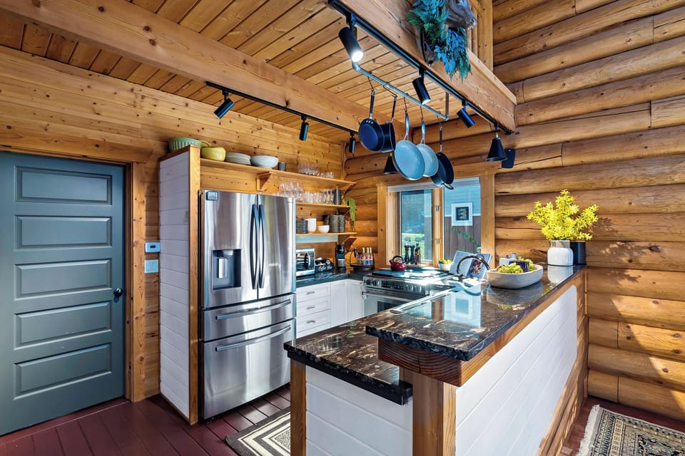 Cook together in a chef’s kitchen blending modern style with cabin charm