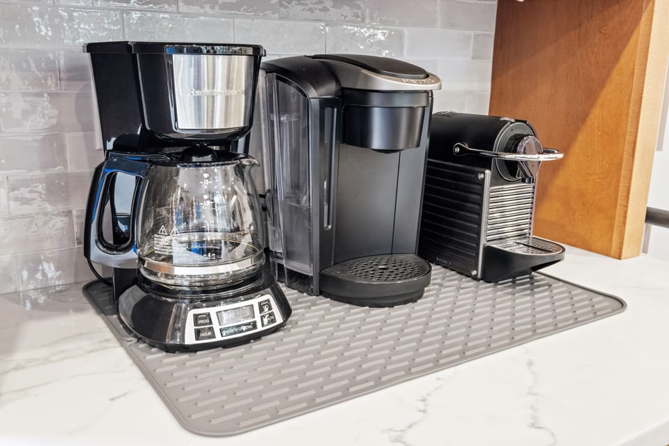 Start your mornings right with a fully stocked coffee station featuring a drip coffee maker, Keurig, and Nespresso machine. Whether you prefer a classic brew or a quick espresso, you’ll have everything you need for the perfect cup.