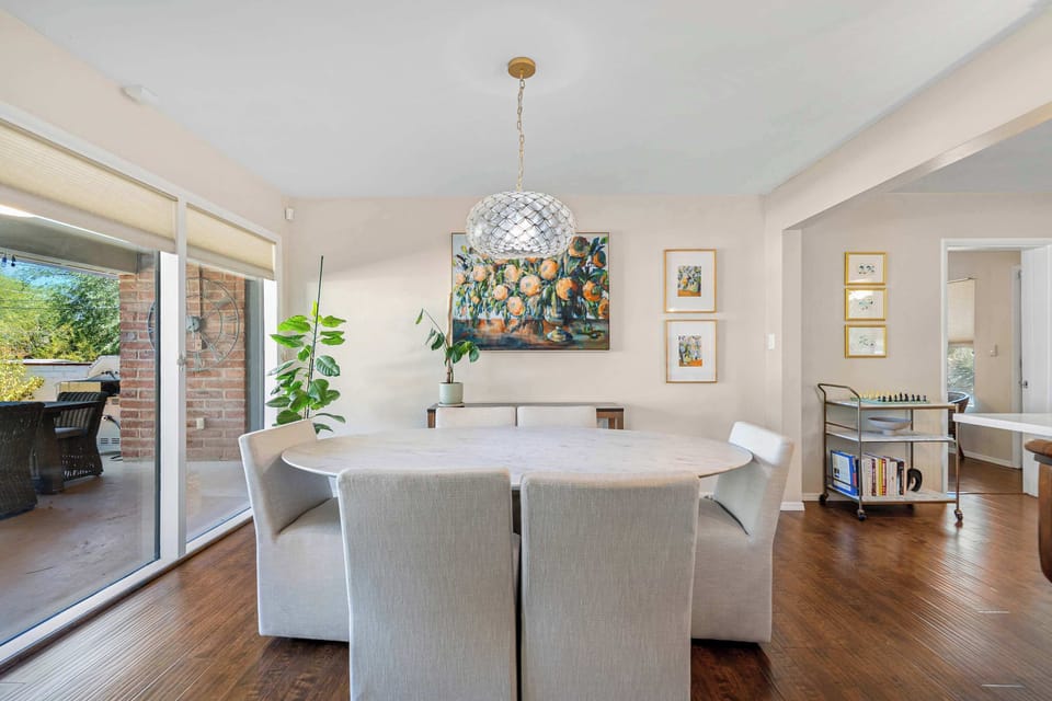 Elegant dining space with seating for six, ideal for enjoying meals together in a warm and inviting atmosphere