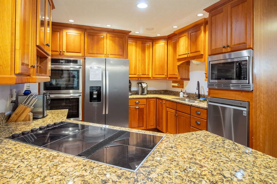 Full kitchen includes cooktop, double ovens, dishwasher, refrigerator, microwave, and more!