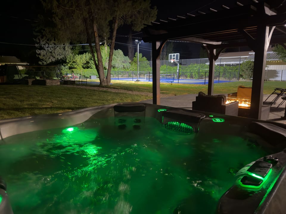 8- person hot tub located on back patio