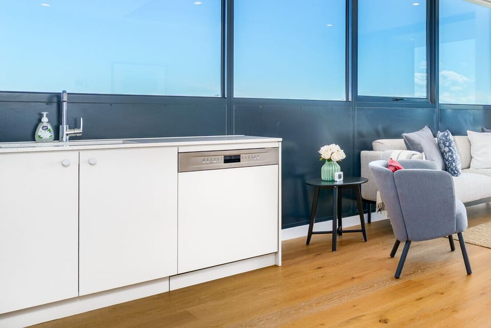 Polished surfaces and modern elegance for a refined kitchen experience.