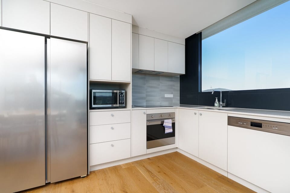 Bright, minimalist kitchen blending style and everyday practicality