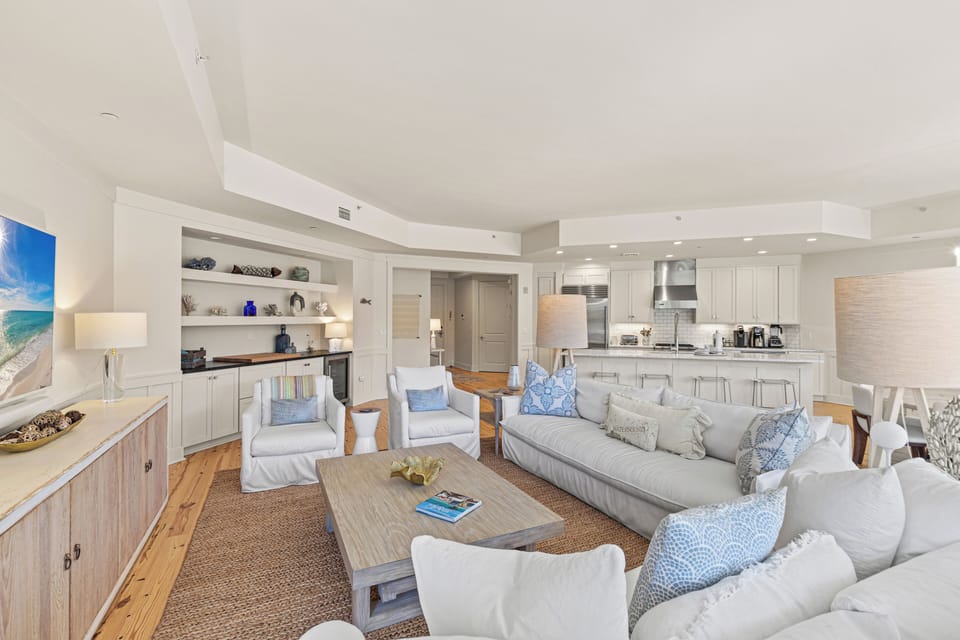 Sink into coastal elegance in your spacious open living area, where soft blues and warm whites create the perfect beachside retreat.
