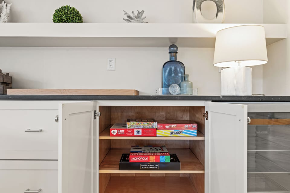 Discover thoughtful touches like board games tucked away in your kitchen cabinet, perfect for cozy evenings with family.