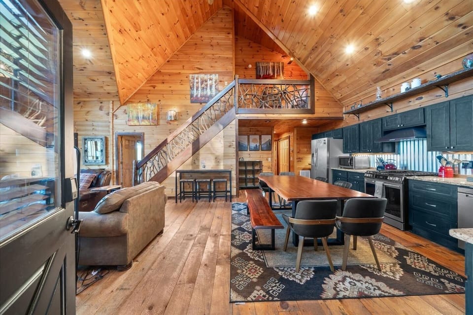 As you enter Blue Fox Den, you are greeted with a beautiful open concept living area with large vaulted ceilings.