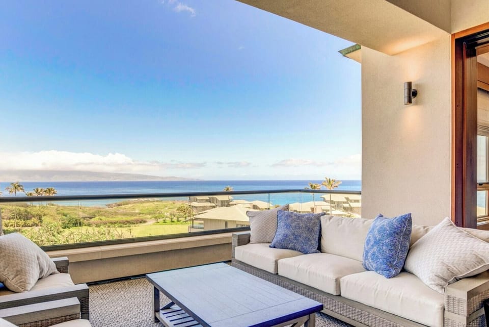 Sink into plush cushions as golden light spills across the horizon and the sea stretches endlessly into the sky’s embrace MON-6401