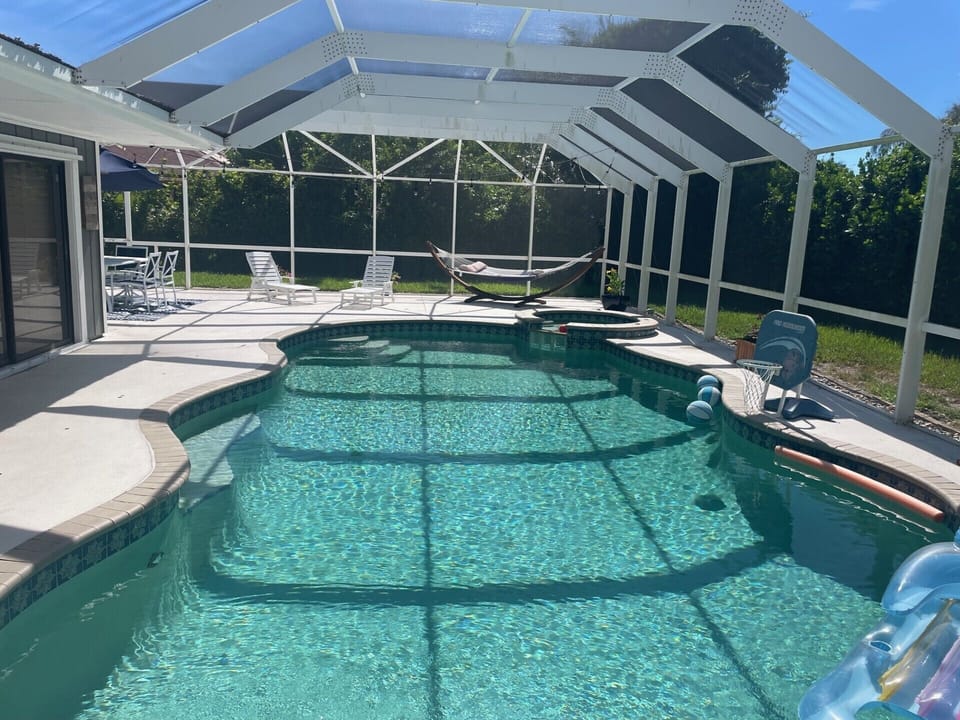 Private pool, outdoor dining, loungers, hammock, and grill