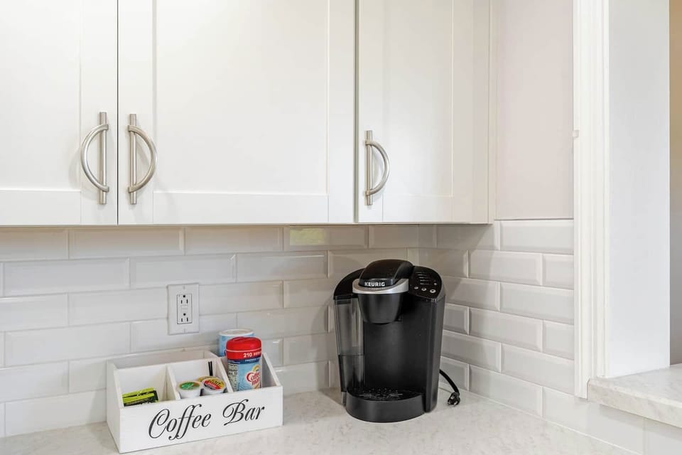 Coffee maker with creamer and sugars. Kuerig