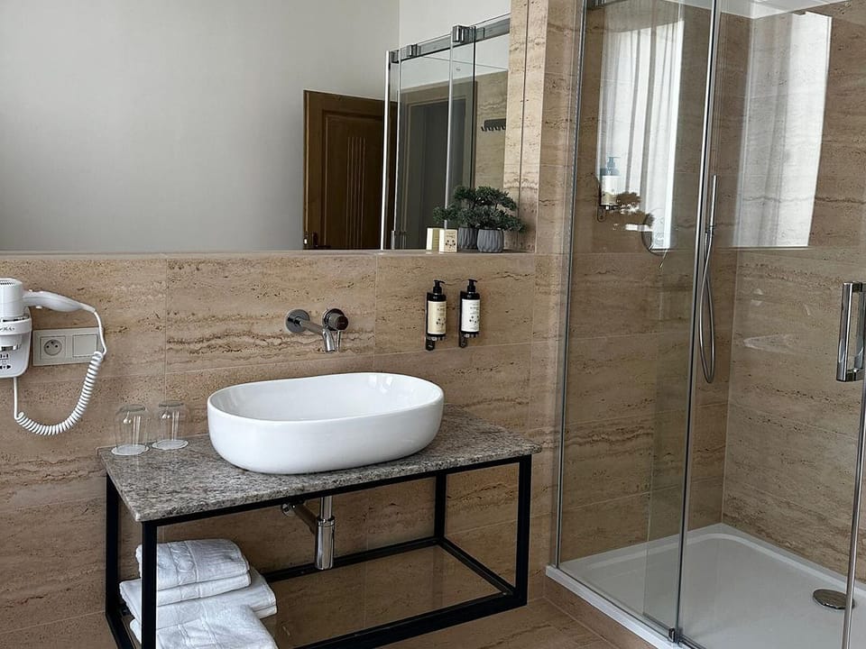 Family Room | Bathroom | Shower, hair dryer, bathrobes, slippers