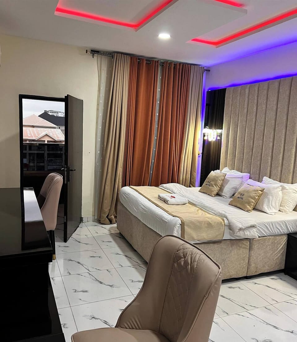 Deluxe Room, Balcony, City View | Desk, laptop workspace, blackout drapes, soundproofing