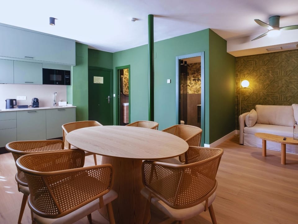 Deluxe Apartment | Living area | 50-inch flat-screen TV with digital channels
