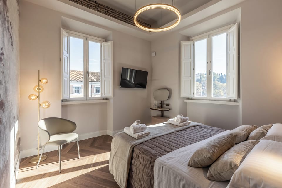 Appartamento Deluxe "vista fiume" | In-room safe, blackout drapes, soundproofing, iron/ironing board