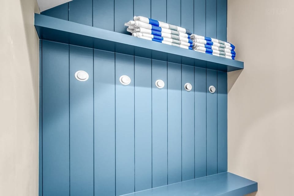 Mud room area with hooks and storage for your beach items