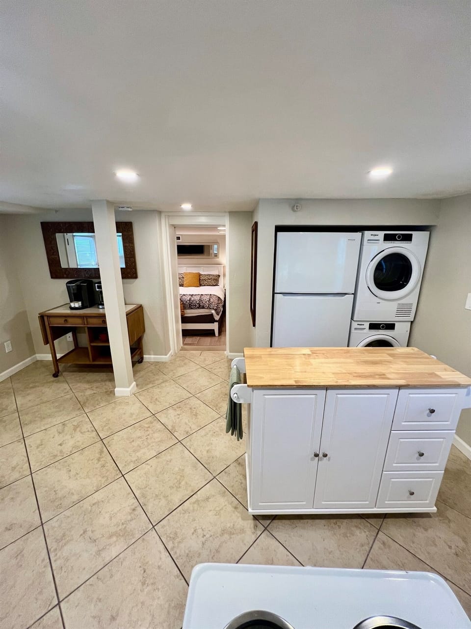 All the comforts of home, including your own in-suite laundry, a full kitchen with a prep island, and a cozy bedroom retreat