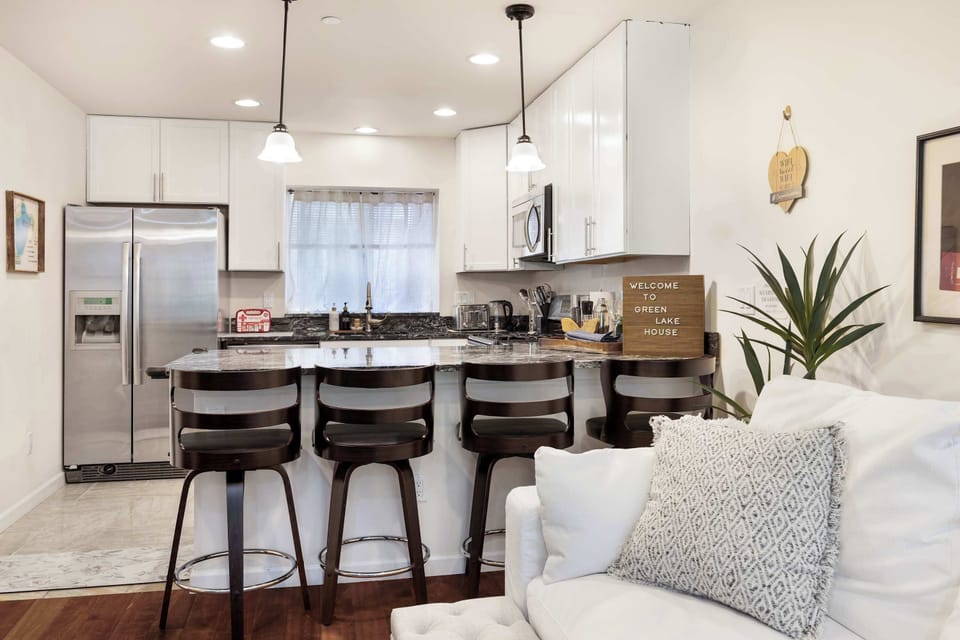 Gather around the breakfast bar for coffee, snacks, or cocktails.