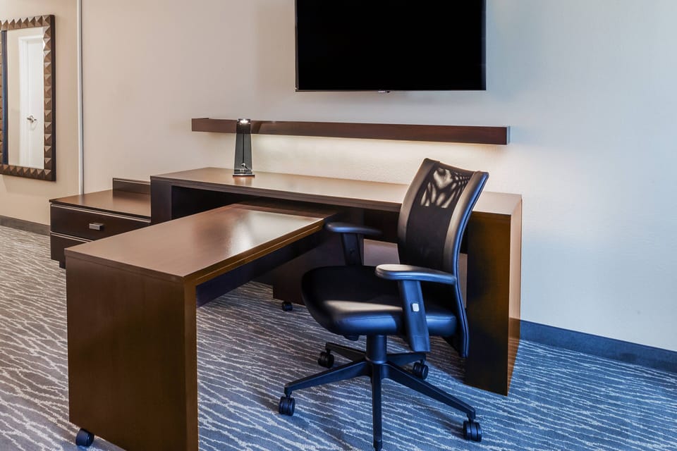 Desk, blackout drapes, iron/ironing board, free cribs/infant beds