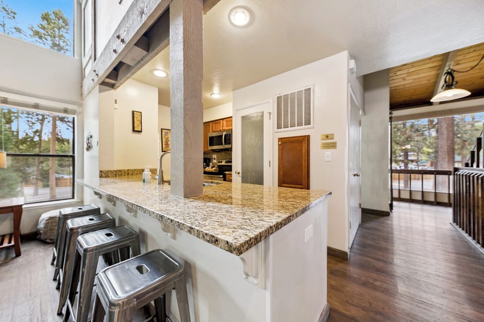 The kitchen island with four seats is perfect for quick breakfasts before Tahoe adventures.