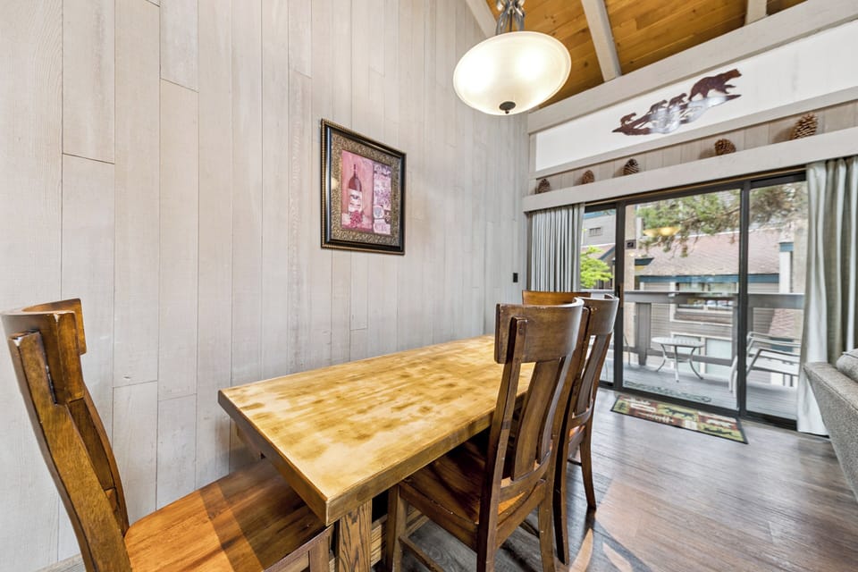Enjoy meals and laughter together around the spacious dining table.
