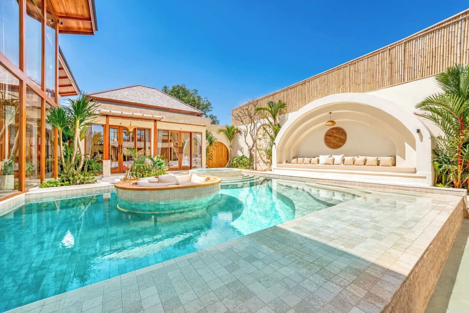 A sculpted tropical sanctuary where modern lines, warm light, and calm water shape pure serenity