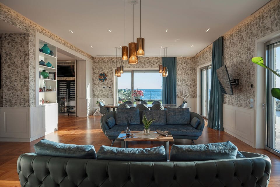 Luxury Apartment | Living area | 70-inch Smart TV with satellite channels