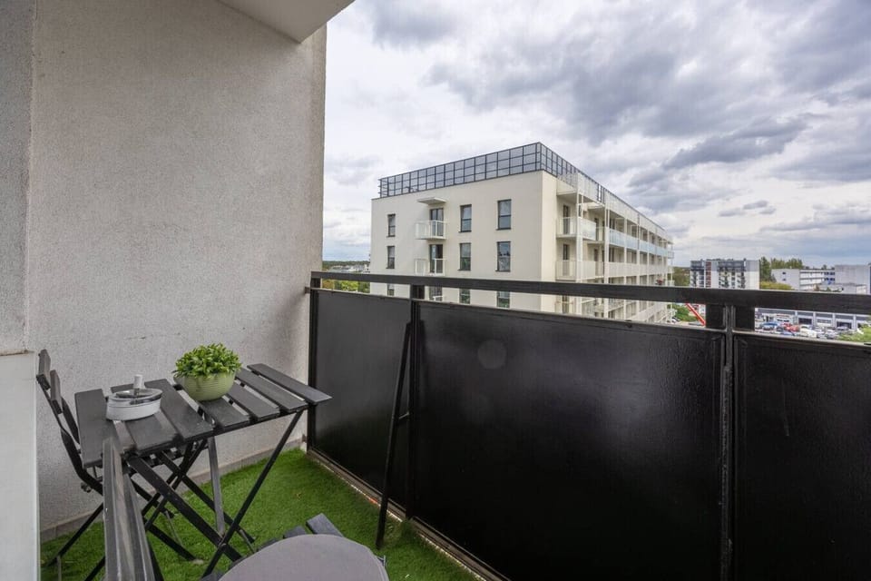 Private Balcony with Outdoor Seating and Pleasant Neighborhood View | Book Now with RENTUJEMY.COM