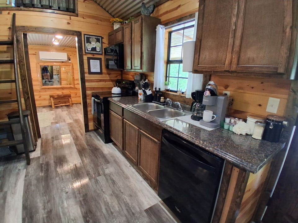 Full kitchen with appliances, cookware & coffee bar — everything you need for cabin meals