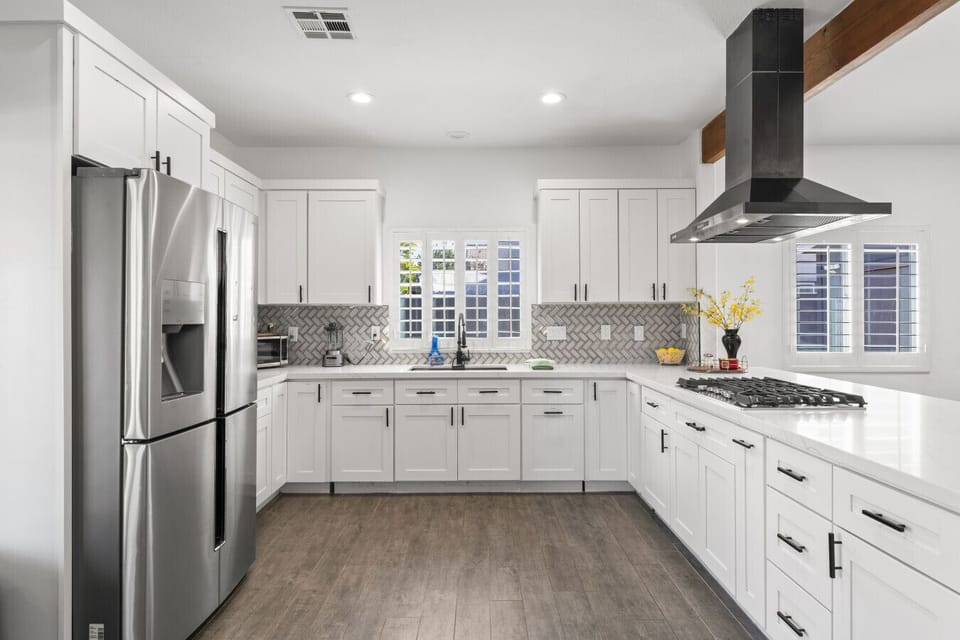 Sleek modern kitchen w/ stainless appliances & plenty of counter space to cook.