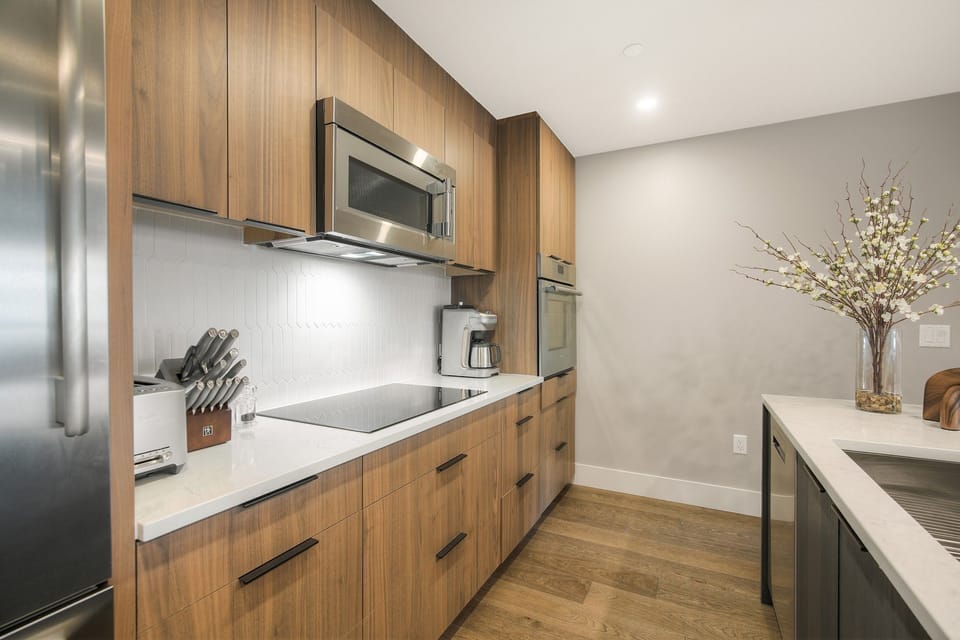 Modern appliances and warm wood cabinetry — a stylish kitchen that's as functional as it looks