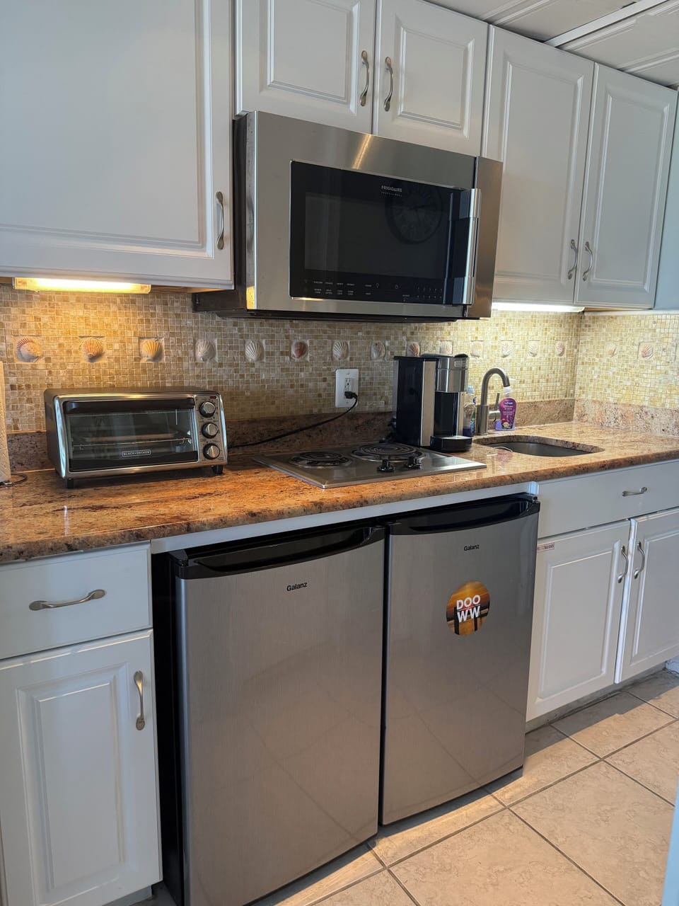 Remodeled kitchen.  Granite countertops. Two under-counter refrigerators.  